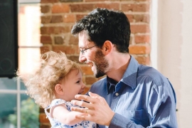 Jeff Kaufman ’08 dances with his daughter Lily